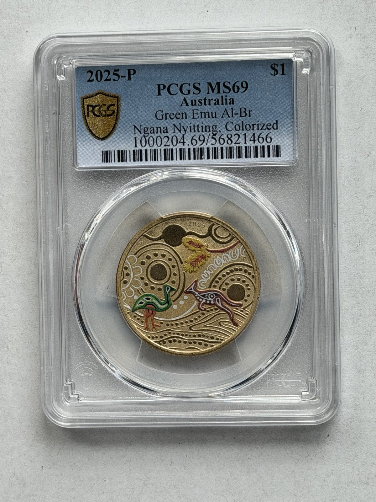 2025-P $1 One Dollar Ngana Nyitting Green Emu PCGS Graded MS69 Coloured Coin