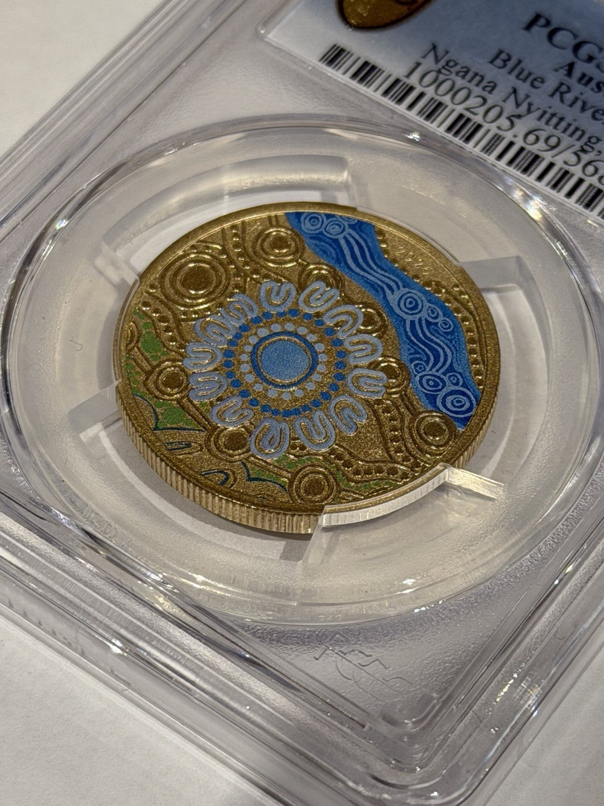 2025-P $1 One Dollar Ngana Nyitting Blue River PCGS Graded MS69 Coloured Coin